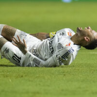 Brazil's Neymar grimaces in pain after he was fouled during his debut for Santos FC in a Sao Paulo league soccer match, against Botafogo-SP in Santos, Brazil, Wednesday, Feb. 5, 2025. (AP Photo/Andre Penner)